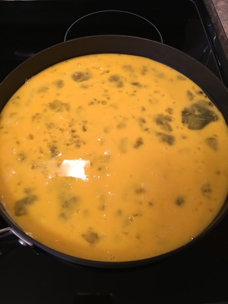 Pour scrambled eggs into the hot pan